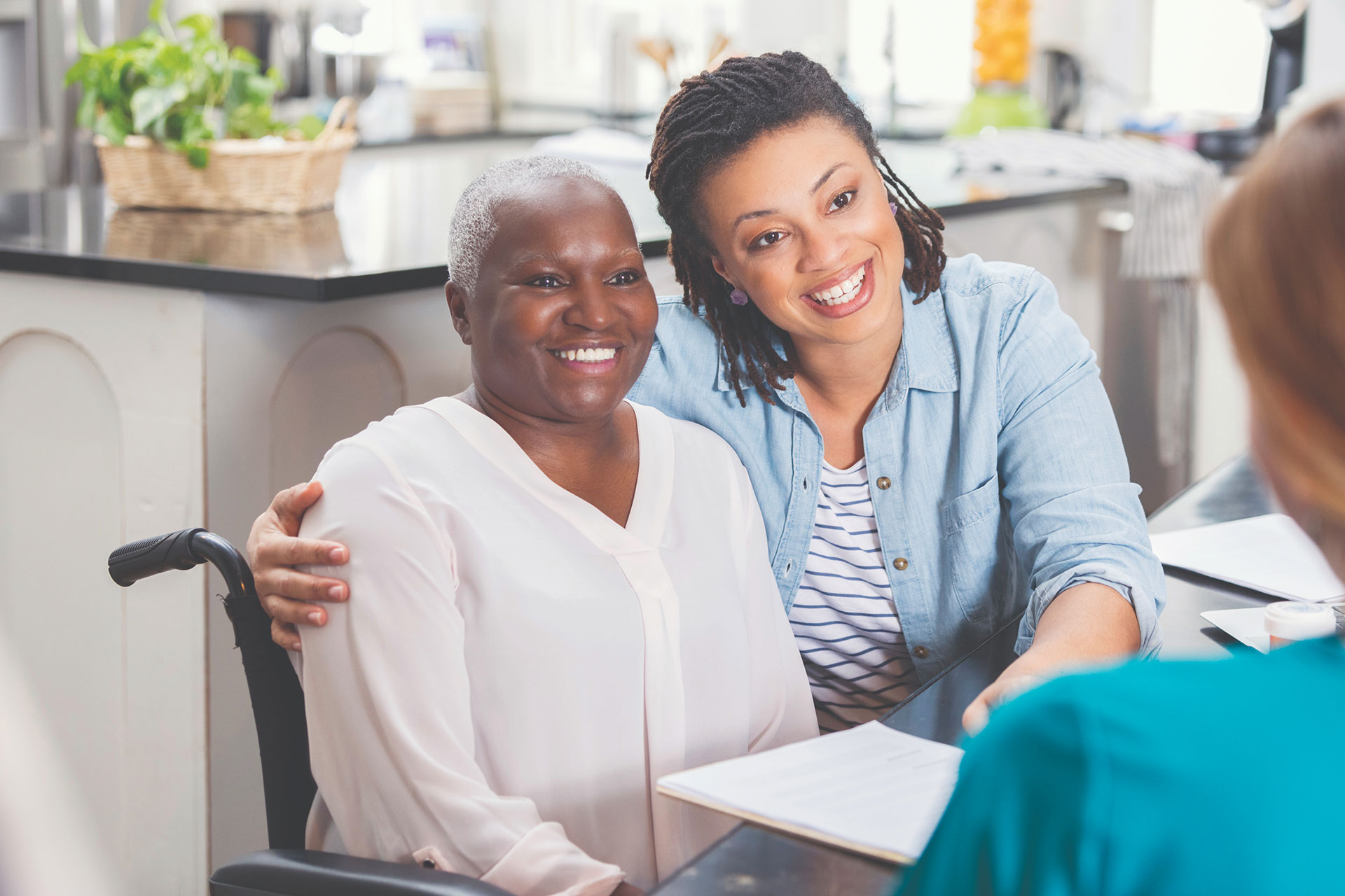 woman sits with her in home care patient