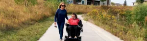 Gerayne Yelkin walking with patient.