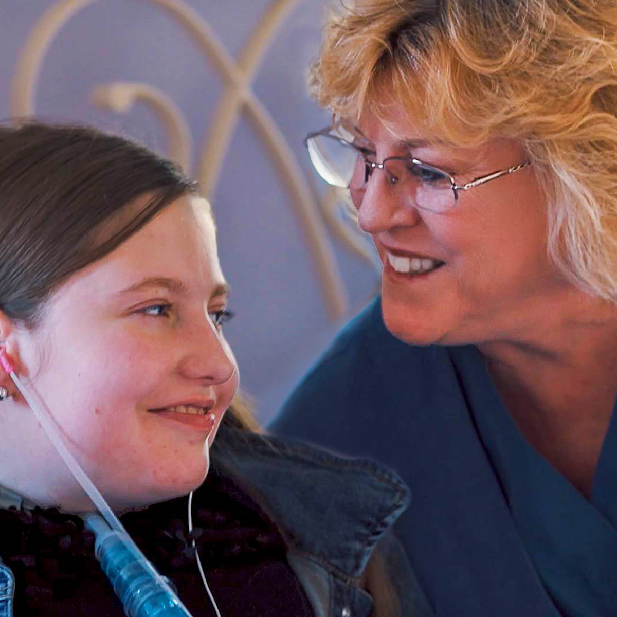 female nurse helps a girl patient