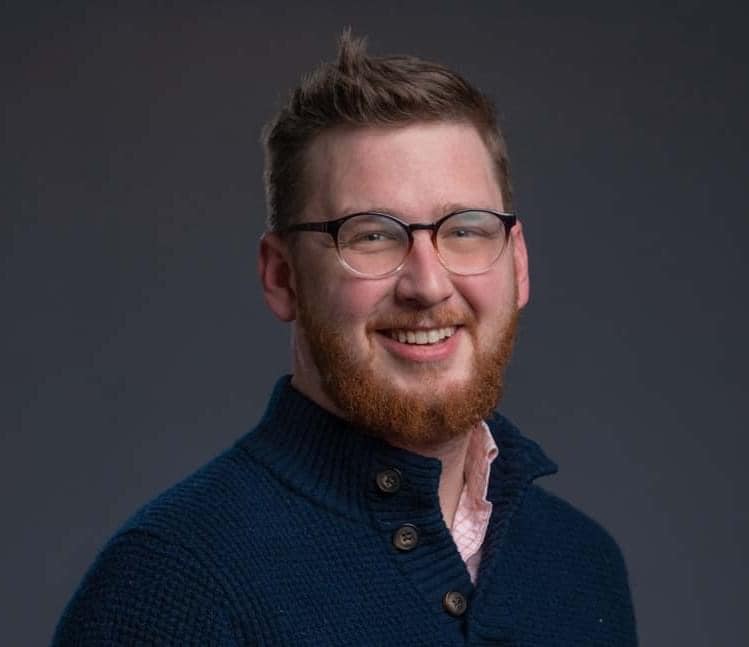 Maxim recruiter Tyler Carlin in a blue shirt