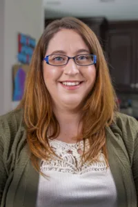 A chubby girl with glasses headshot