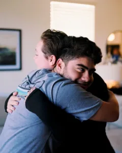 Cairlin Drumel hugging a Patient