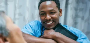 Compassionate male nurse providing personalized care and support to patient