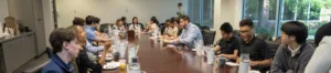Photo of people working at a large conference table