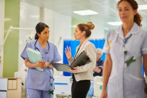 Admin staff talking to nurse